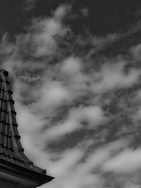 Low angle view of building against cloudy sky