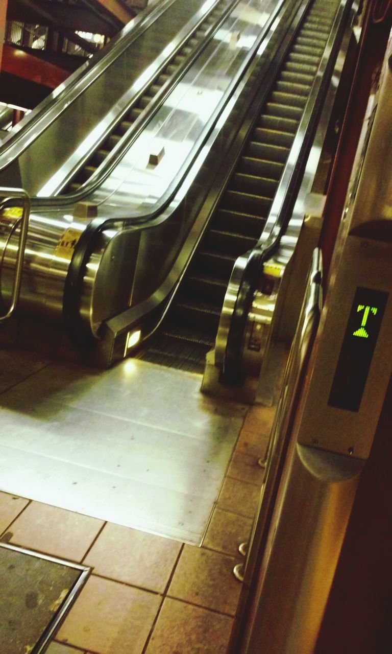 indoors, illuminated, transportation, high angle view, public transportation, empty, escalator, technology, absence, modern, in a row, convenience, subway station, built structure, architecture, no people, ceiling, rail transportation, travel, railroad station