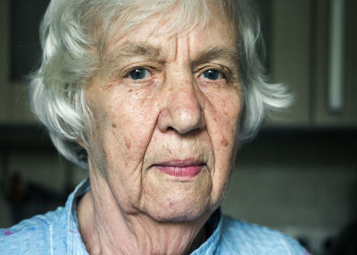 Close-up portrait of senior woman indoor
