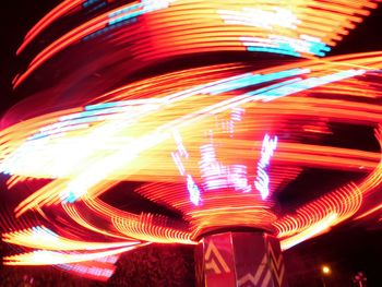 Low angle view of illuminated lights at night