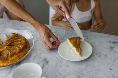 Cropped hand of person preparing food