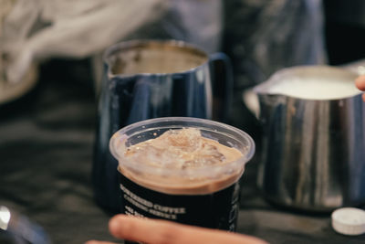 Close-up of hand holding drink