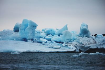 Scenic view of frozen lake against sky