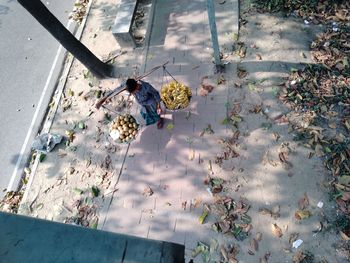 High angle view of woman standing on street