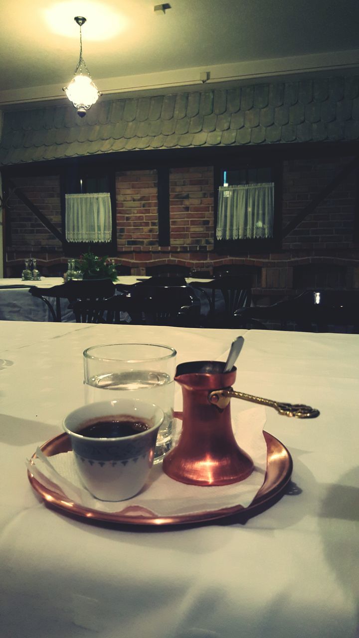 indoors, table, illuminated, lighting equipment, still life, home interior, food and drink, absence, glass - material, drink, no people, empty, chair, electric lamp, lit, window, domestic room, lamp, drinking glass, transparent