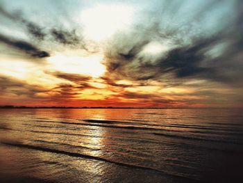 Scenic view of sea against dramatic sky