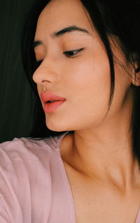Close-up of young woman looking away