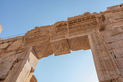Low angle view of old ruins against clear sky