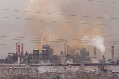 Panoramic view of factory against sky