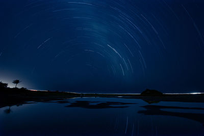 Scenic view of sea against sky at night