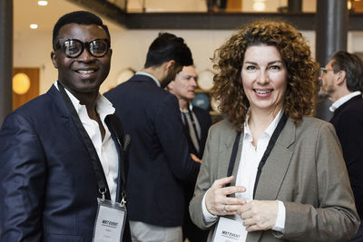 Portrait of smiling entrepreneurs during seminar at conference center