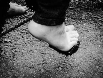 Low section of woman standing on tiled floor