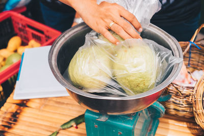 High angle view of person preparing food on table