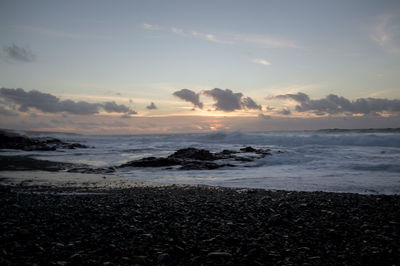 Scenic view of sea against sky during sunset