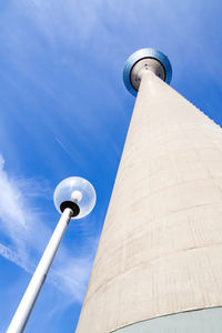 Low angle view of communications tower against sky