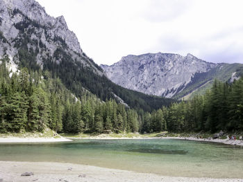 Scenic view of lake and mountains against sky