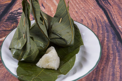 High angle view of leaves in plate on table