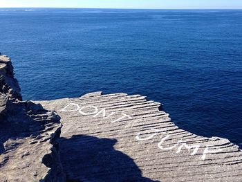 Scenic view of sea against blue sky