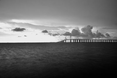 Bridge over sea against sky