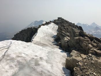 Scenic view of mountains against clear sky during winter