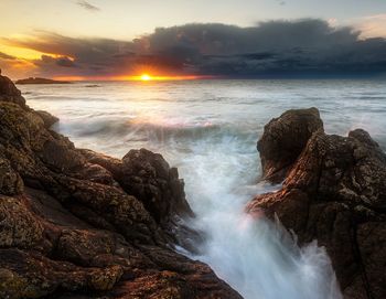 Scenic view of sea against sky during sunset