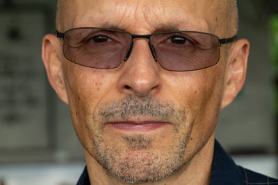 Close-up portrait of man wearing eyeglasses