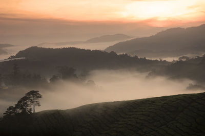 Scenic view of mountains against sky during sunset