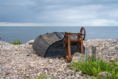 An old wooden boat on the seashore