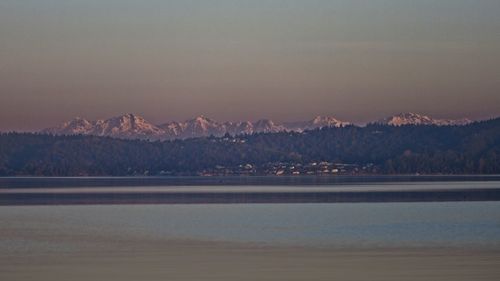 Scenic view of sea against sky during sunrise