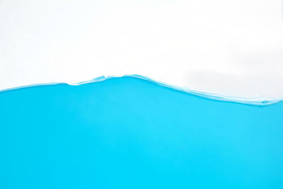 Close-up of blue sea against sky