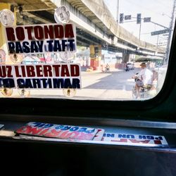 Text on car window in city