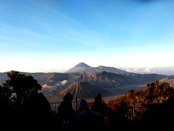 View of volcanic craters against blue sky