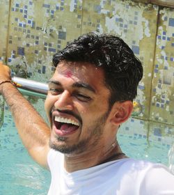 Portrait of young man in swimming pool