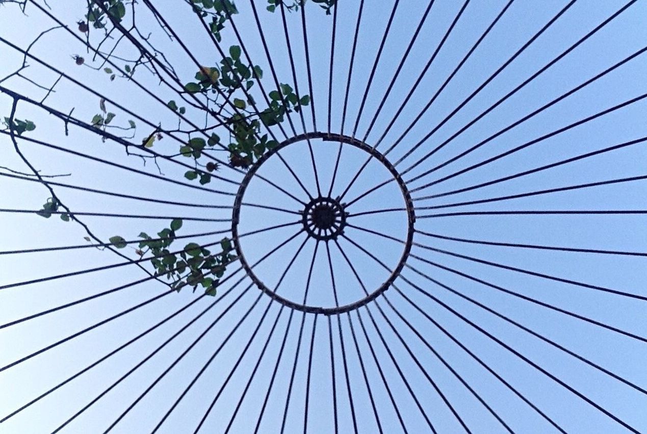 LOW ANGLE VIEW OF CEILING AGAINST BLUE SKY