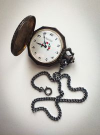 Close-up of clock on table