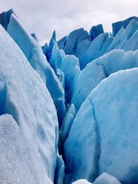 Scenic view of glacier against sky