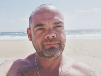 Close-up of shirtless man at beach
