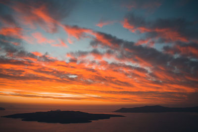 Scenic view of dramatic sky over sea during sunset