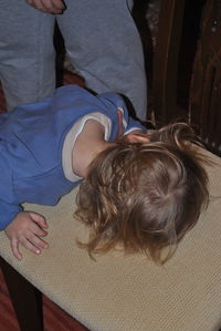 Rear view of friends relaxing at home