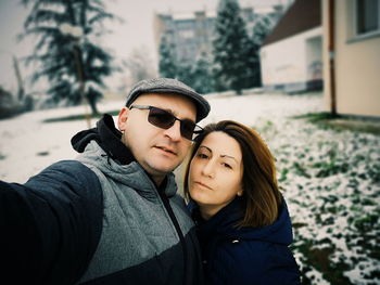 Portrait of young couple on snow