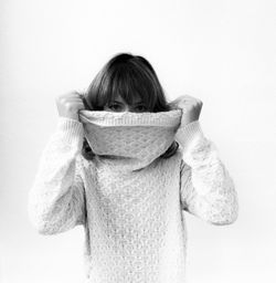 Woman looking away over white background