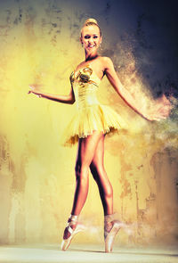 Digital composite image of ballet dancer dancing by wall