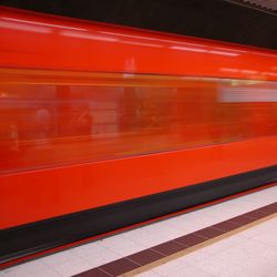 Blurred motion of train at railroad station platform