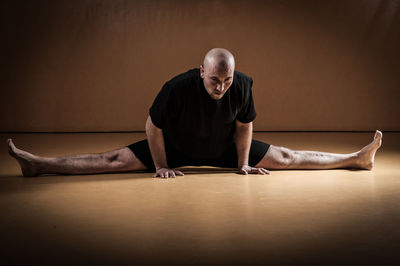 Man exercising on floor