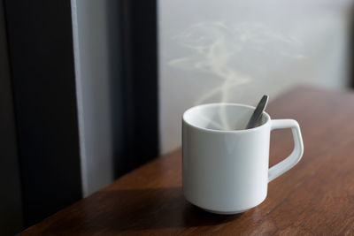 Close-up of coffee cup on table