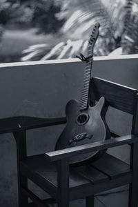 Guitar on chair in balcony