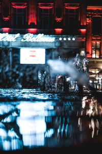 Reflection of illuminated building in water