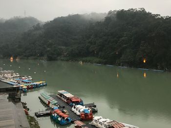 High angle view of boats sailing in river