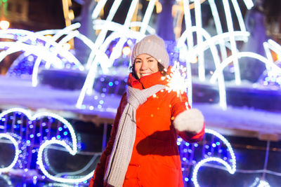 Portrait of smiling man standing in snow