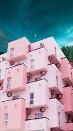 Low angle view of buildings against blue sky